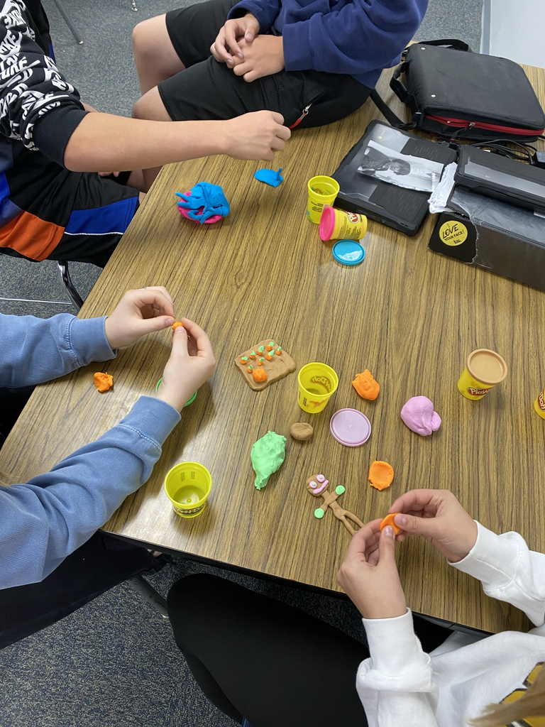 Students working with play dough