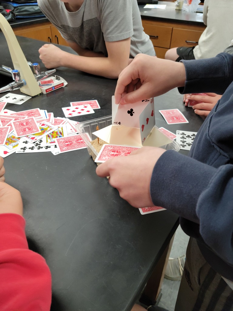 Students using playing cards to learn about tectonic plates 