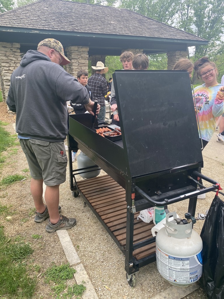 Dan Llewellyn grilling hot dogs for lunch