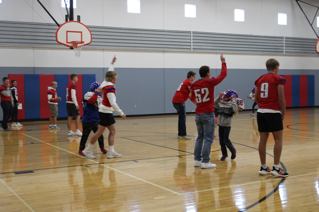 Football players at the elementary pep rally