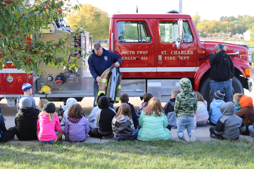 Elementary students and the fire truck visit