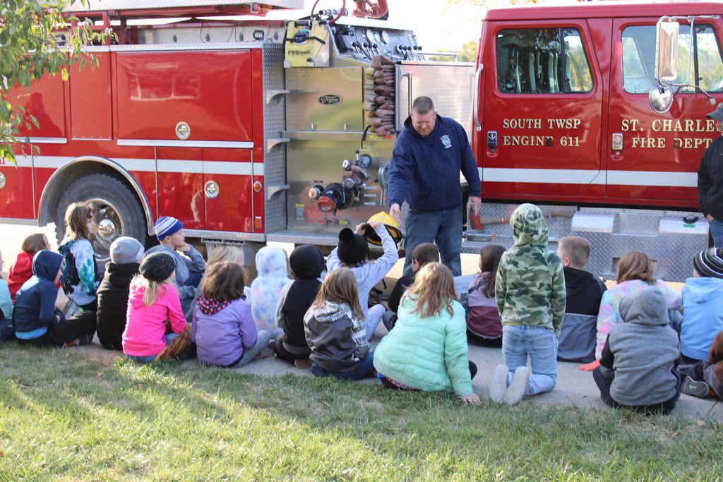 Elementary students and the fire truck visit